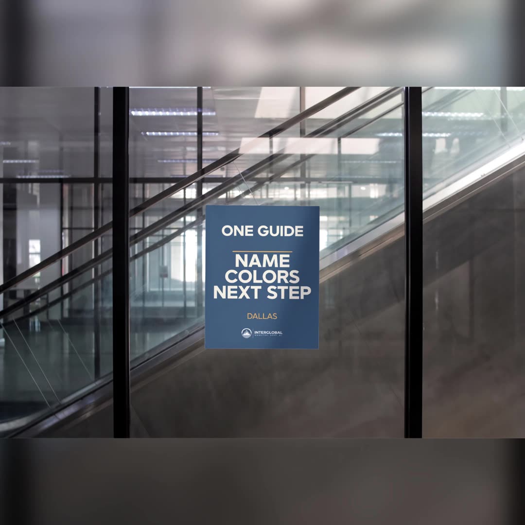 A poster on glass reads One Guide, with the name, the colors, the next step, and the InterGlobal logo. Mockup, not a client.