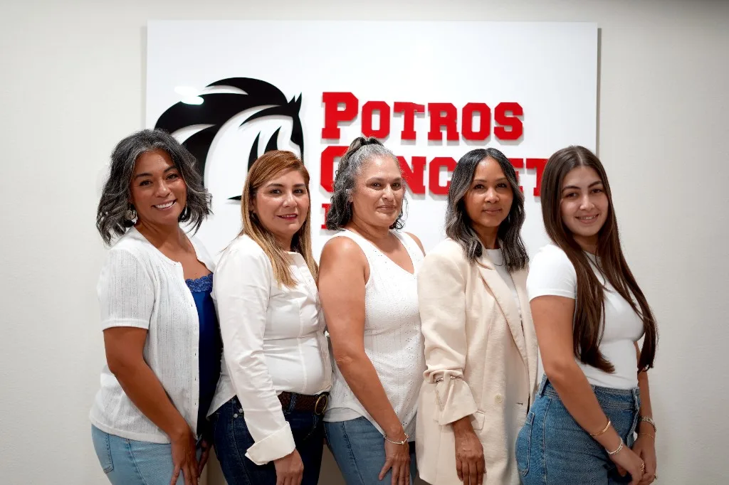 Potros Concrete LLC: the team in front of the office mark